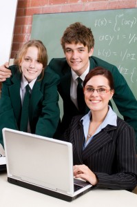Students with teacher and computer